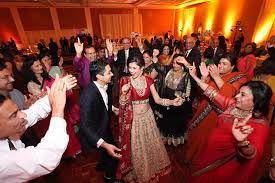 A Dalit wedding party dances to DJ music